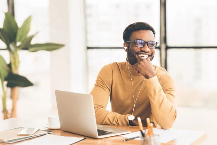 A practitioner smiling on a client call